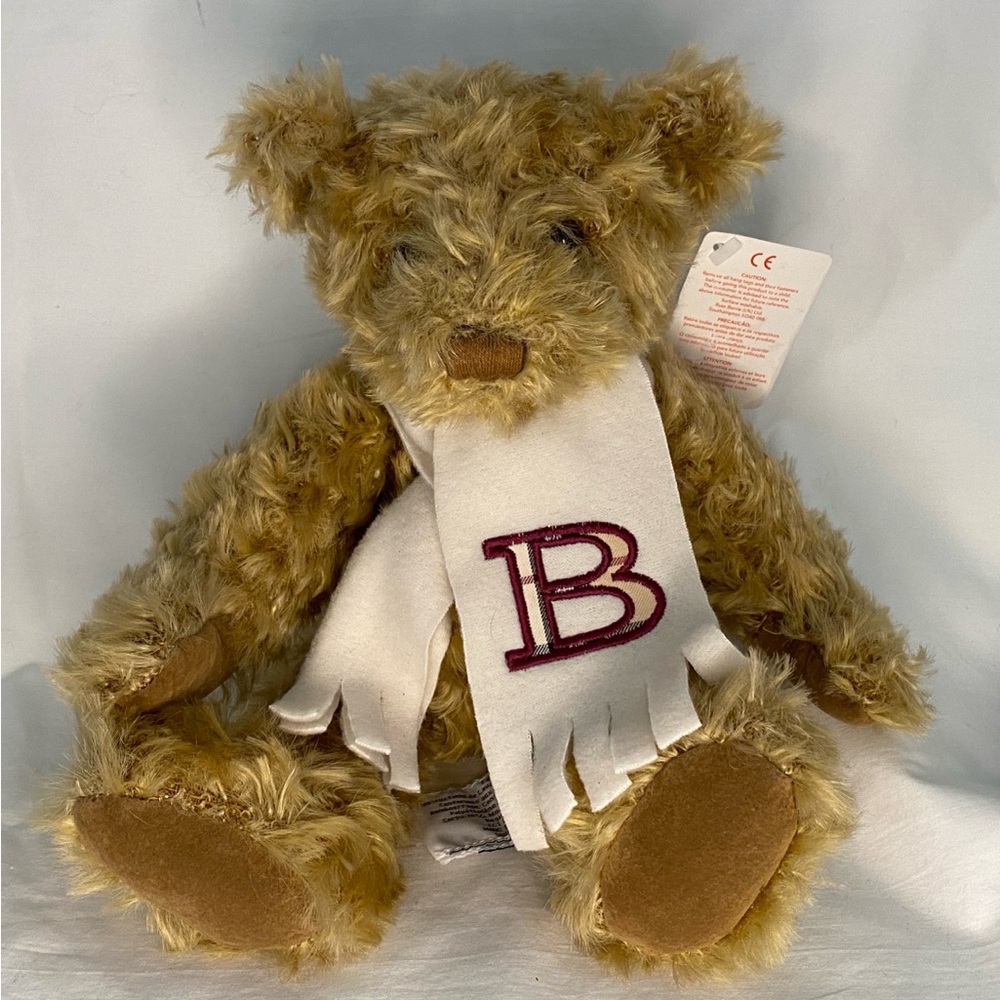 Burberry teddy bear with the “B” logo scarf